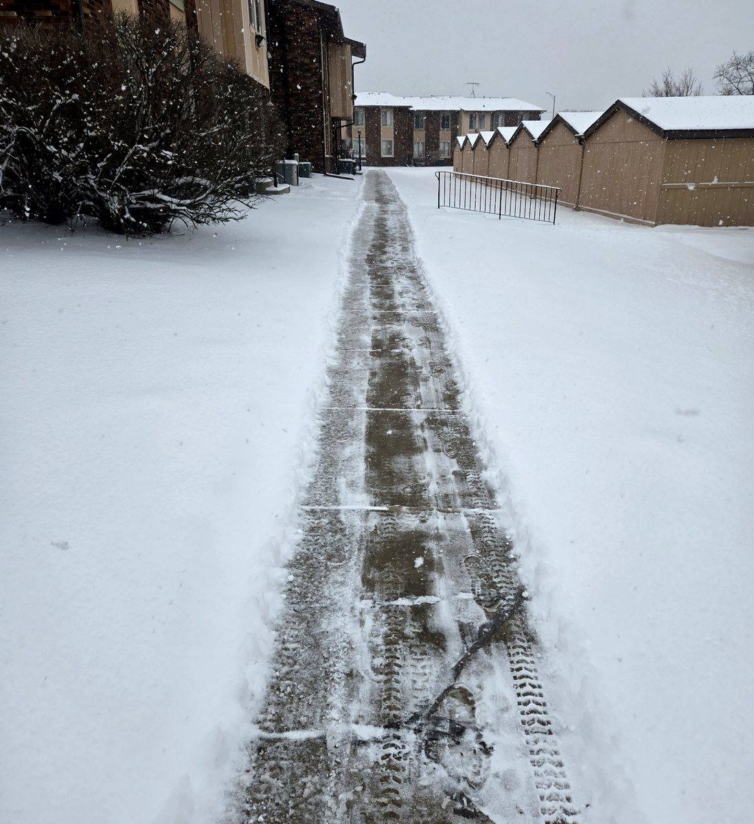 The same walk in winter, cleared end to end through snow